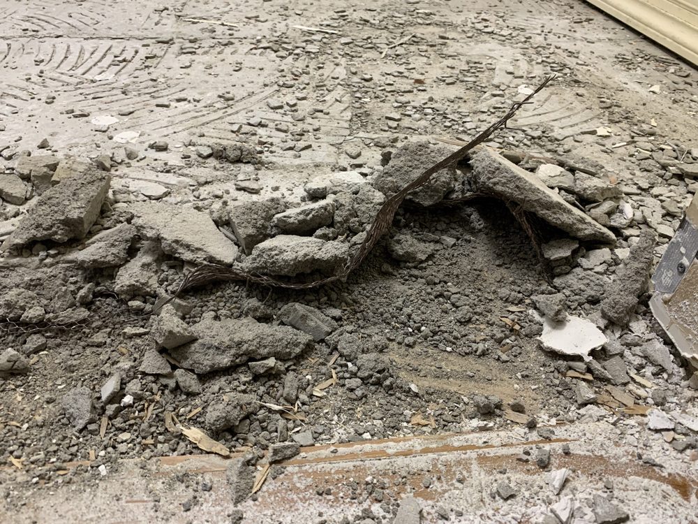 Broken old tile and concrete substrate after demolition